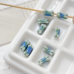 Detailed view of tie-dye ceramic bamboo joint beads for DIY jewelry making