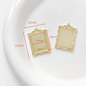 Detailed macro view of 18k gold plated vintage photo frame pendant with 32x22mm dimensions