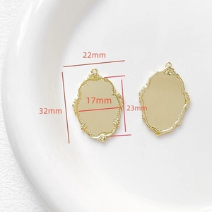 Detailed view of 18k gold-plated baroque style oval pendant frame with size measurements