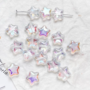 Close-up of iridescent star-shaped glass beads for DIY jewelry and crafts with AB coating