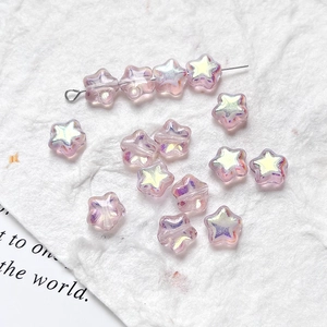 Macro view of star-shaped purple Czech glass beads with iridescent AB coating for DIY