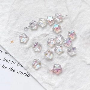 Macro shot of iridescent aurora coating star beads for DIY jewelry making and crafts