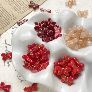 Vintage red butterfly glass beads with gold thread accents for DIY jewelry making