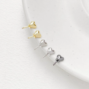 Minimalist heart-shaped jewelry pins in gold, silver and black with polished finish