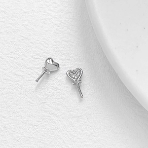 Detailed view of heart-shaped silver plated jewelry pins for DIY handcrafted accessories