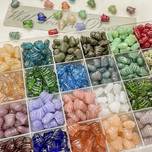Christmas vintage bell glass beads set in a clear organizer box for DIY jewelry making