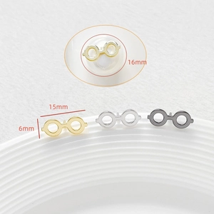 Close-up of minimalist eyeglass jewelry pins showing precise 15mm width measurements