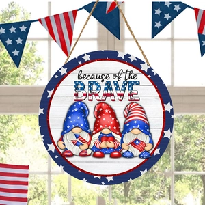 Macro detail of round wooden patriotic gnome welcome sign with rustic rope hanger