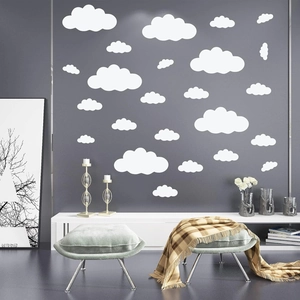 Minimalist white cloud wall stickers in various sizes on dark grey background for kids room