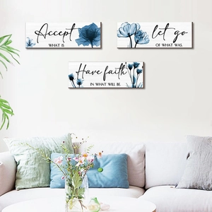 Three-piece floral wall art set with blue ink flowers and inspirational quotes on wood