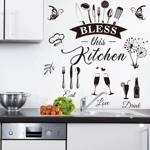 Black PVC wall decal with BLESS this Kitchen text and cutlery icons on white wall