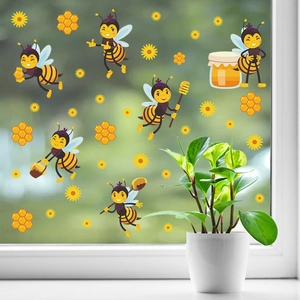 Detail of cute bee window stickers with sunflowers and honeycomb on glass surfaces