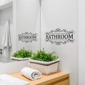 Elegant black Bathroom wall sticker with scroll patterns on white tile background