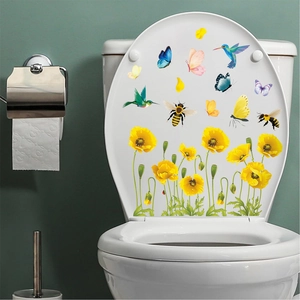 Detail der WC-Deckel-Aufkleber mit gelben Aquarellblumen und Kolibris auf Weiß