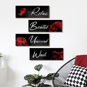 Set of four black wooden wall plaques with red roses and Relax Breathe Unwind Wash text