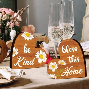 Set of two heart-shaped wooden signs with daisy print and inspirational home quotes