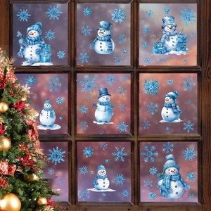 Christmas snowman and snowflake window stickers on a wooden frame with holiday lights