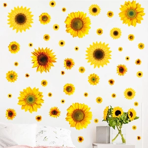 Vibrant sunflower wall decals set in various sizes on a clean white bedroom wall