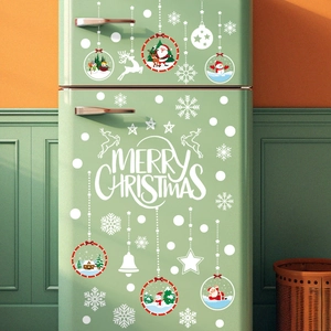 Christmas wall decals with Santa, snowman and reindeer on a green vintage refrigerator