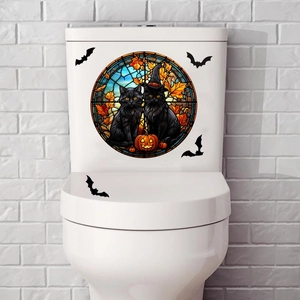 Halloween bathroom window decals featuring black cats and pumpkin lanterns on a toilet tank