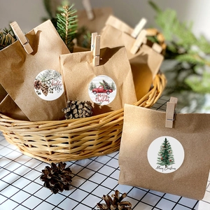 Christmas round stickers with truck and pinecone patterns on kraft gift bags