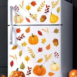 Fall window stickers with pumpkin and maple leaf decals on white refrigerator surface