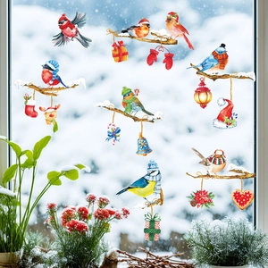Christmas window stickers featuring colorful birds on snowy branches with festive decor