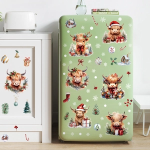 Christmas Highland Cow window stickers with festive trees, snow and gift box on fridge