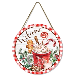 Round gingerbread Christmas welcome sign with pine branches and red plaid border decor