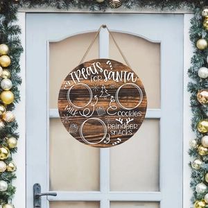 Round wooden Christmas Santa treats board with hanging rope and festive pine decoration