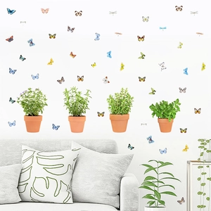 3D colorful butterfly and dragonfly wall decals set over a white sofa in a modern home