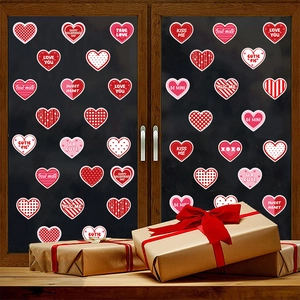 Valentine heart stickers with LOVE YOU text on window with a gift box setup