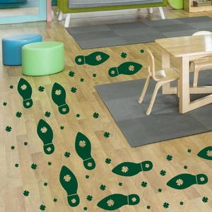 Green St. Patrick's Day leprechaun footprint stickers with shamrock designs for floors