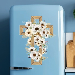 Easter cross wall sticker with white flowers and gold leaves on a light blue fridge