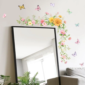 Floral wall stickers with colorful butterflies decorating a modern mirror in home interior