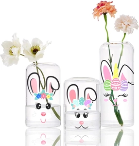 Three Easter bunny glass vases in graduated sizes featuring cute cartoon face prints