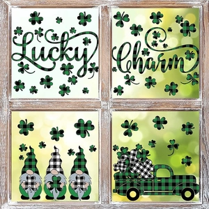 St. Patrick's Day window decals with gnomes and clovers on a vintage white wooden window