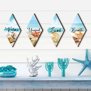 Set of four diamond-shaped wooden beach wall art signs featuring Relax, Unwind, Soak, Breathe
