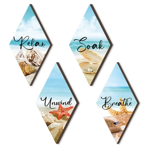 Set of 4 diamond-shaped wooden beach wall art featuring shells, starfish and coastal themes