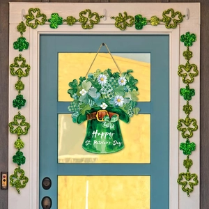 St. Patrick's Day green hat door sign with clover and daisy decorations on wooden door