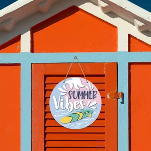 Round wooden Summer Vibes welcome sign with surfboard and wave patterns for home decor