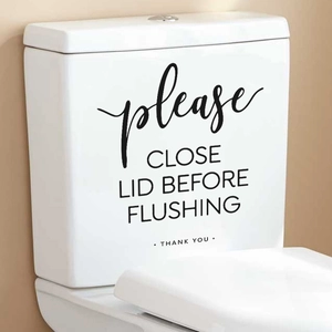 Close-up of PVC toilet sticker with 'Please Close Lid Before Flushing' text on a tank