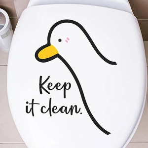 Cute duck toilet lid sticker with 'Keep it clean' text on white porcelain surface