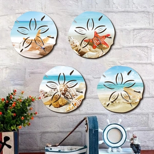 Set of four nautical wall plaques with starfish and shells on white brick background