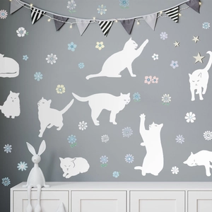 Detail view of white cat silhouette wall stickers with floral and star decals for kids room