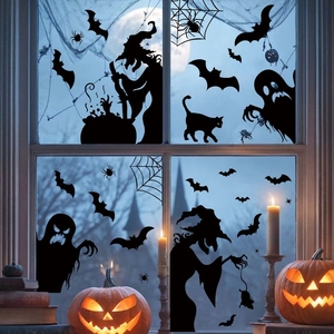 Halloween window stickers featuring witch silhouettes, bats, and cats on a glass window