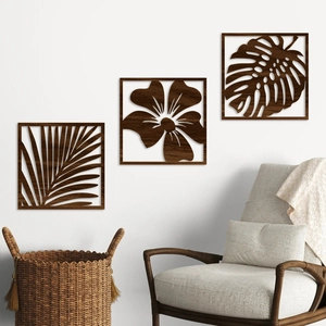 Three-piece modern hollow wood leaf wall art set with tropical monstera and palm patterns