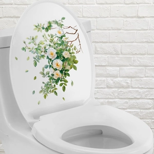 Close-up of white rose floral decal on toilet lid made of waterproof PVC material