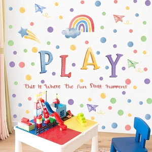 Detail of PVC wall sticker with colorful dots, rainbow, stars and Play lettering for kids room