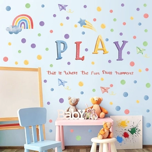 Detail of watercolor rainbow and polka dot wall stickers for kids playroom decoration